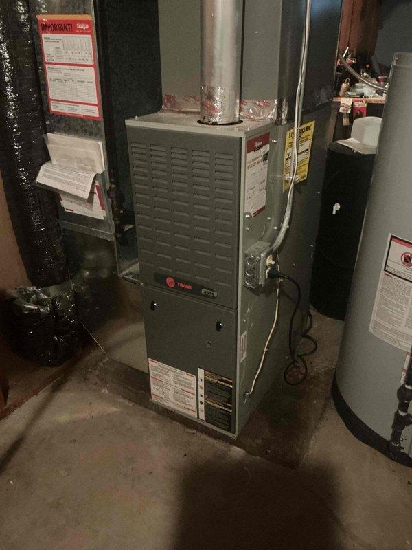 Performed comprehensive maintenance inspection on 23-year-old Trane furnace unit. Conducted full system evaluation including cleaning and testing flame sensor, verifying control board operation, inspecting heat exchanger integrity, measuring amp draws, testing blower capacitor, and examining burner condition. Performed combustion analysis and verified temperature rise within manufacturer specifications. Filter found to be clean. All major components functioning properly; however, igniter showing signs of weakness and recommended for replacement to prevent future ignition failures. Reviewed findings and replacement options with homeowner.