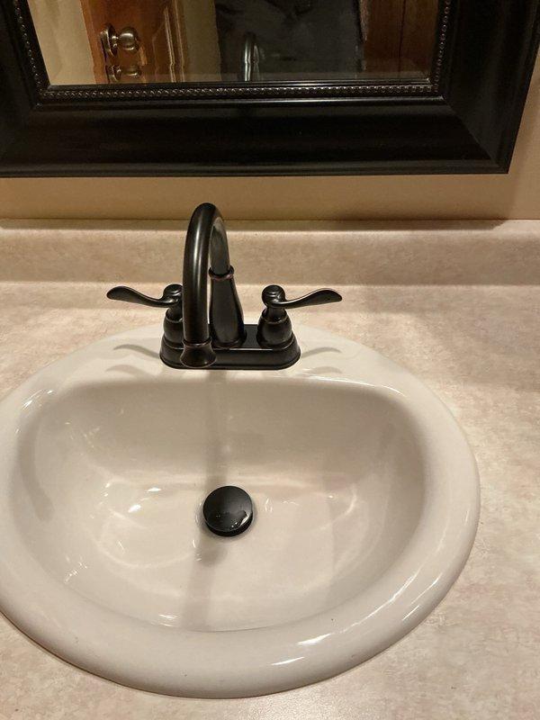 Responded to service call for leaking bathroom faucets. Removed two old bathroom faucets that were experiencing leakage issues. Installed two customer-supplied replacement faucets in bathroom sink locations, including mounting hardware, supply line connections, and drain assemblies. Verified proper water flow and tested all connections for leaks. Ensured proper operation of hot and cold water handles and confirmed drain stopper functionality. All plumbing connections secured and system restored to full working order.
