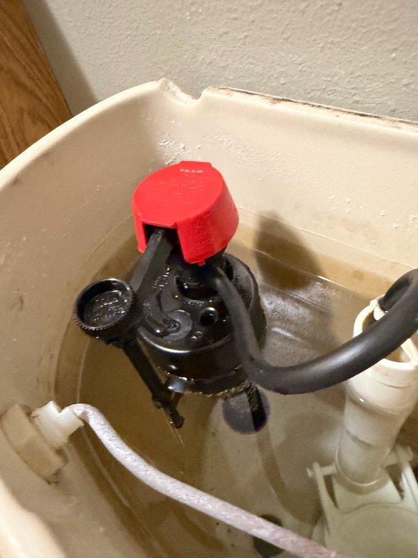 Responded to callback for continuously running toilet following recent fill valve installation. Upon inspection, identified that fill valve float stop point was set too high, causing float to catch on bowl fill tube and prevent proper shutoff. Adjusted float stop point to correct height, tested flush cycle five times to verify proper operation and consistent shutoff, and reinstalled toilet seat to complete service.