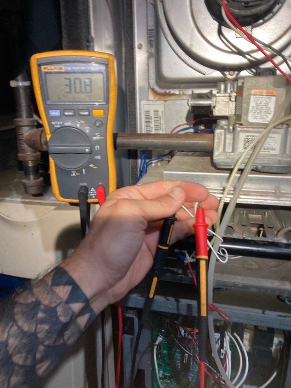 Performed HVAC certification inspection on a 2004 Lennox 80% efficiency furnace. During heat exchanger examination, discovered water staining around an eye ring and identified a small crack in the middle burner section. Conducted combustion analysis testing which showed gas pressure at 3.62 w.c. and carbon monoxide levels at 40 ppm, both within acceptable parameters. Inspected flame sensor, igniter, blower motor, and inducer motor—all components found to be functioning properly. Noted air filter required replacement. Due to heat exchanger deterioration and burner crack presenting potential safety hazards, red-tagged the unit and shut off gas supply to the furnace per safety protocols. Contacted homeowner to explain critical findings and safety concerns; homeowner requested estimate for complete system replacement.