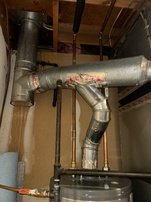 Responded to callback for air conditioning system not cooling. Performed diagnostic testing on thermostat control circuit and identified intermittent failure of Ecobee PEK (Power Extender Kit) module causing loss of cooling call. Confirmed indoor and outdoor equipment functionality by manually jumping R to Y terminals at air handler control board, verifying low voltage cooling circuit operational. Observed thermostat experiencing multiple power dropout cycles before stabilizing, isolating fault to PEK module rather than HVAC equipment. Documented control board wiring configuration and existing thermostat wire limitations. Presented repair options including standard thermostat replacement or installation of new 5-conductor thermostat cable with dedicated common wire to eliminate PEK module dependency. Customer approved installation of new thermostat wiring to resolve intermittent failure issue. Photographed existing ductwork configuration in basement utility area and control board termi