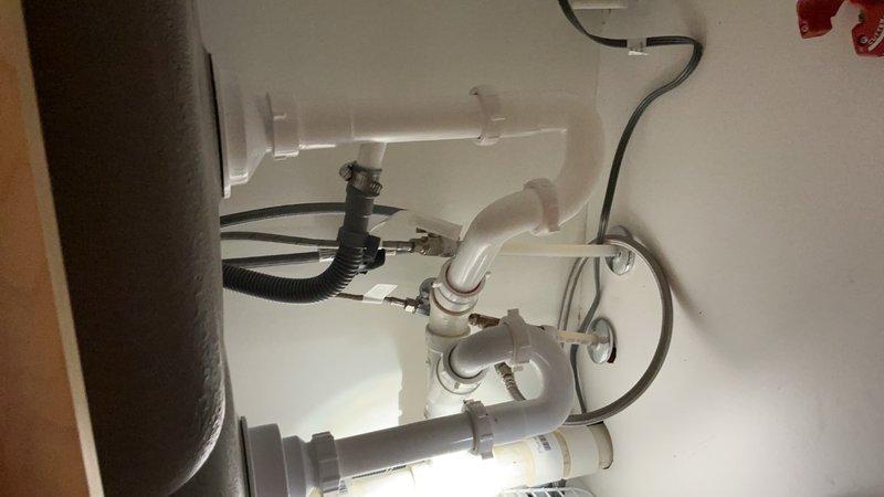 Completed toilet tank flush valve rebuild to restore proper flushing operation. Installed matching sink basket strainers in both basins of the kitchen double-basin sink, ensuring proper drainage and updated appearance. All plumbing connections verified for proper operation and tested for leaks.