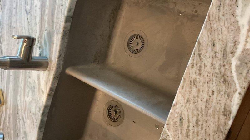 Completed toilet tank flush valve rebuild to restore proper flushing operation. Installed matching sink basket strainers in both basins of the kitchen double-basin sink, ensuring proper drainage and updated appearance. All plumbing connections verified for proper operation and tested for leaks.