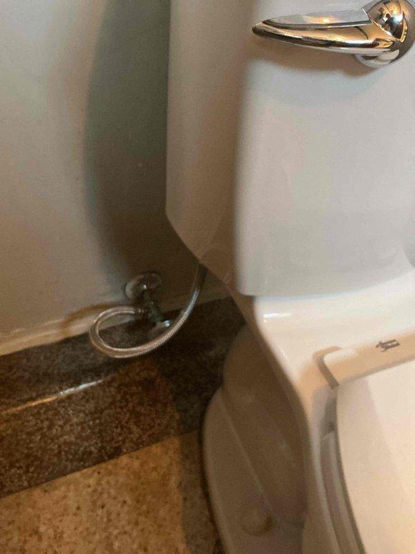Responded to a no-water issue at a public restroom toilet. Upon inspection, discovered significant sediment buildup in both the angle stop valve and toilet supply line, preventing water flow to the fixture. Disassembled the angle stop, thoroughly flushed the valve body and connections to remove accumulated debris, and installed a new braided stainless steel toilet supply line to restore proper water delivery to the tank.
