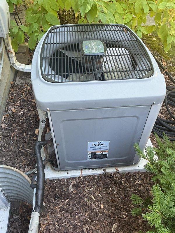 Responded to no-cool call on 26-year-old air conditioning system. Found blown fuses at outdoor disconnect, replaced fuses and performed system diagnostics. Compressor drawing high amperage and refrigerant pressures fluctuating over 20 psi, indicating internal restriction. System contains obsolete refrigerant. Advised customer this is a temporary repair with no guarantee due to age and condition of equipment, and scheduled same-day replacement estimate.