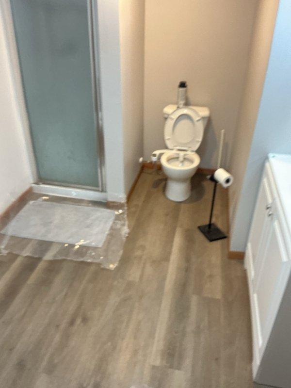 Responded to sewer backup occurring in basement bathroom during laundry use. Performed camera scope inspection of the sewer line and identified severe tree root intrusion causing the blockage. Removed toilet to access the main drain line and utilized multiple cable machines to clear the obstruction, extracting a massive amount of tree roots from the system. Cabled the shower drain and floor drain to restore proper flow throughout all basement bathroom fixtures. Reinstalled toilet, tested all drains for proper operation, and verified complete system functionality with adequate flow restored.