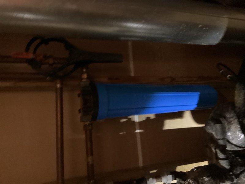 Completed complimentary plumbing inspection of mechanical room containing aging equipment and infrastructure. Documented existing copper piping, HVAC ductwork, and water treatment components including blue filter housing system. Technician scheduled for follow-up water analysis and preparation of equipment replacement bid.