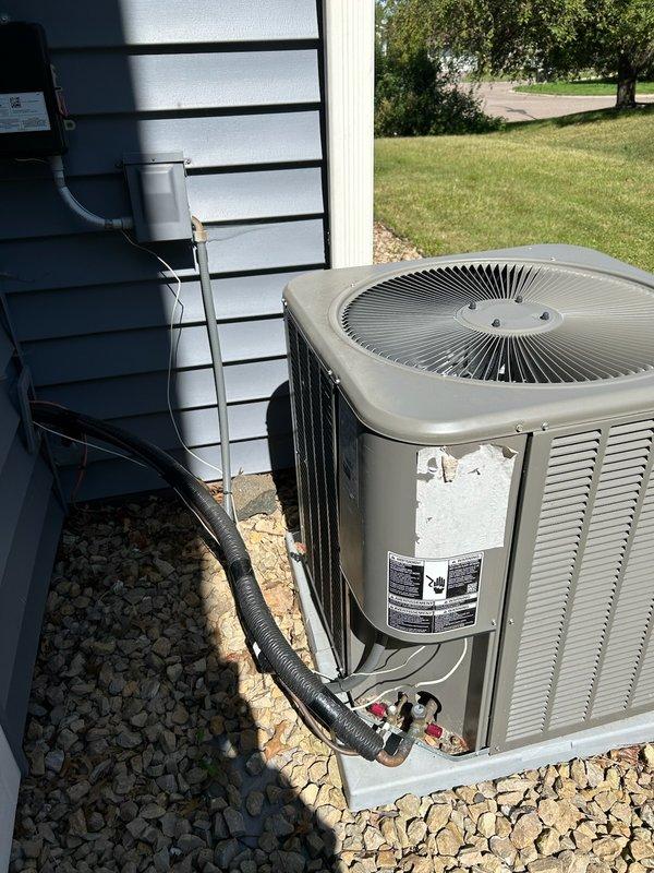 Provided second opinion diagnostic service on Lennox AC system that was not cooling after previous company replaced thermostat and contactor but failed to resolve the issue. Verified thermostat was calling for cooling but outdoor unit remained off; heating mode operated normally. Discovered intermittent operation when disconnect box was touched, indicating electrical fault. Upon inspection, found burnt fuse and severely damaged wiring inside disconnect box. Confirmed suction line temperature indicated system would operate properly once electrical issue was resolved. Recommended scheduling licensed electrician to replace disconnect box and damaged wiring to restore safe system operation.