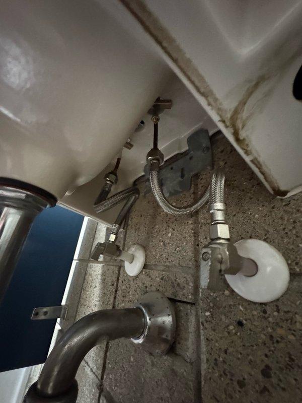 Responded to callback for water heater installed last month that was not producing hot water. Upon inspection, diagnosed faulty heating element and thermostat. Replaced defective element and thermostat to restore proper hot water function. Additionally addressed 20+ year old bathroom faucet with persistent drip leak. Due to age and condition of existing fixture, removed old faucet and installed new bathroom faucet assembly with supply lines, eliminating the leak and ensuring proper operation.