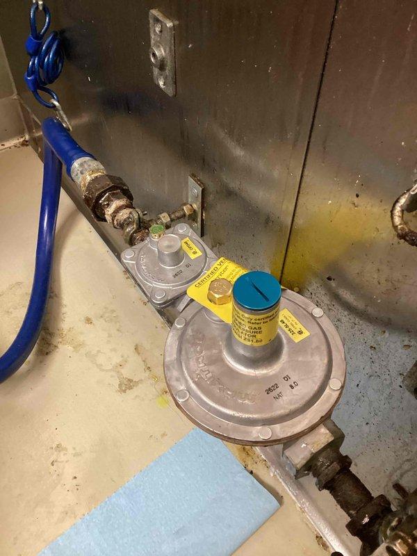 Responded to no-gas condition at commercial fryer. Upon inspection, determined the high-pressure regulator had failed and was not allowing gas flow to the equipment. Removed the corroded existing regulator and installed a new high-pressure gas regulator, restoring proper gas supply to the fryer and returning the unit to full operation.