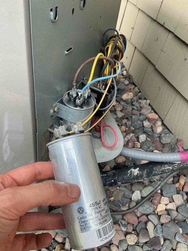 Responded to no cooling complaint on approximately 10-year-old air conditioning system. Upon arrival, unit was humming but outdoor fan would not start. Diagnosed failed dual run capacitor using clamp meter to verify amperage readings. Replaced defective capacitor with new unit meeting manufacturer specifications. Installed hard start kit to compressor to improve starting performance and extend equipment life. Tested system operation and verified proper amperage draw on all components. Unit cooling normally at time of departure.