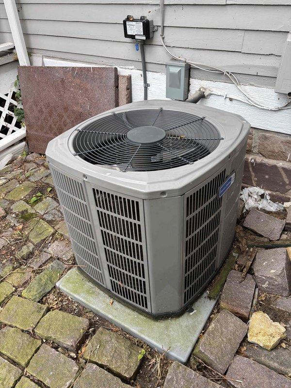 Completed annual heating and cooling maintenance on one furnace and one air conditioning system. Furnace inspection included filter, temperature split, burners, flame sensor, igniter, motors, capacitor, drain, and heat exchanger—all components operating normally with filter replacement recommended. Follow-up scheduled for CO level verification as combustion analyzer was unavailable at time of service. Air conditioning maintenance performed with R-410A refrigerant system operating at 87-degree ambient temperature; inspected filter, thermostat, temperature split, condenser, coils, motors, capacitors, compressor, refrigerant charge, and drain. Diagnosed no-cooling condition caused by failed Y terminal on equipment zone board—thermostat outputting proper 24V signal to zone board, but zero voltage present at cooling terminal. Bypassed faulty zone board Y terminal by jumping thermostat Y wire directly to equipment, restoring cooling operation. Low voltage repair approved and completed; both 