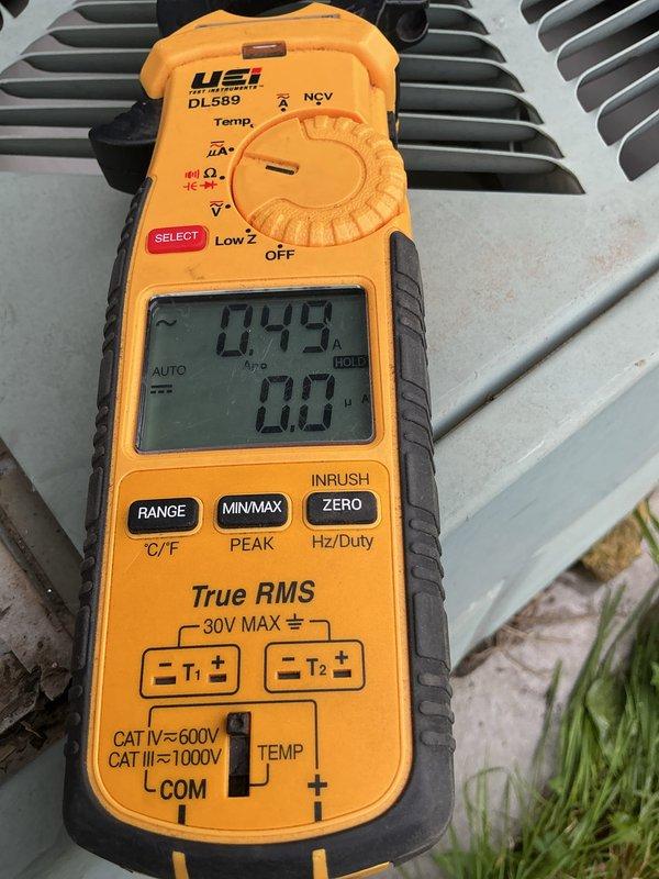 Completed comprehensive maintenance on 24-year-old R22 air conditioning system and furnace. Replaced failed dual capacitor and contactor, cleaned blower wheel, and replaced draft motor. Performed standard tune-up procedures on both heating and cooling systems, with multimeter testing confirming proper amperage draw of 0.49A on replaced components.
