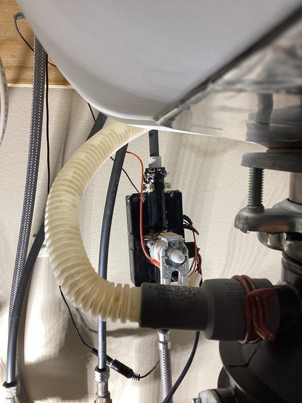Responded to service call for non-functioning Delta touch-activated kitchen faucet. Diagnosed faulty solenoid valve assembly preventing proper touch activation. Disconnected electrical leads from existing solenoid unit and removed failed component from under-sink mounting location. Installed Delta-provided adapter assembly to accommodate replacement solenoid valve. Connected supply lines and electrical wiring to new solenoid unit, securing connections with appropriate fasteners. Tested touch activation functionality and verified proper water flow and shutoff operation. System restored to full working order.