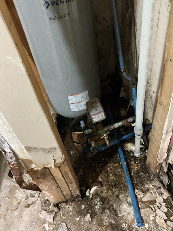 Responded to callback for second opinion on water treatment system performance issues. Upon inspection, confirmed well supply insufficient to maintain flow demand for neutralizer system. Observed Pentair Wellmate pressure tank and dual-tank water treatment system with digital control valves. Determined issue related to well pump depth and water recovery rate rather than recently replaced equipment. Recommended contacting well service contractor to evaluate pump placement and potentially lower pump assembly to access deeper water table for improved flow capacity.