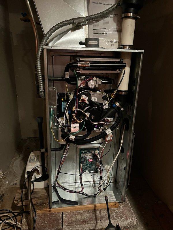 Responded to no cooling complaint following power outage. Upon arrival, system operated normally in heating mode but failed to initiate cooling cycle. Performed diagnostic testing by jumping thermostat wires at wall unit, which successfully engaged outdoor condensing unit, indicating thermostat issue. Replaced weak batteries in thermostat. Discovered and removed rodent nest from outdoor condenser unit that posed potential airflow restriction and fire hazard. Cycled system through multiple cooling calls to verify proper operation. All components functioning correctly upon departure.