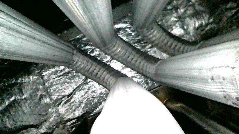 Performed annual furnace maintenance on a 4-year-old system as part of a recurring maintenance agreement. Conducted comprehensive inspection including thermostat operation, indoor air handler components, air filter, condensate drain, blower motor, inducer motor, and electrical wiring—all found to be operating within normal parameters. Verified temperature split across the system and inspected critical furnace components including igniter, flame sensor, and gas pressure readings.

During heat exchanger inspection, identified a compromised heat exchanger presenting a safety hazard. Immediately shut off gas ball valve to the furnace and red-tagged the system to prevent operation until repairs are completed. Documented findings with photographs of the installation and affected components. Completed parts order form and prepared estimate for heat exchanger replacement to restore safe system operation.