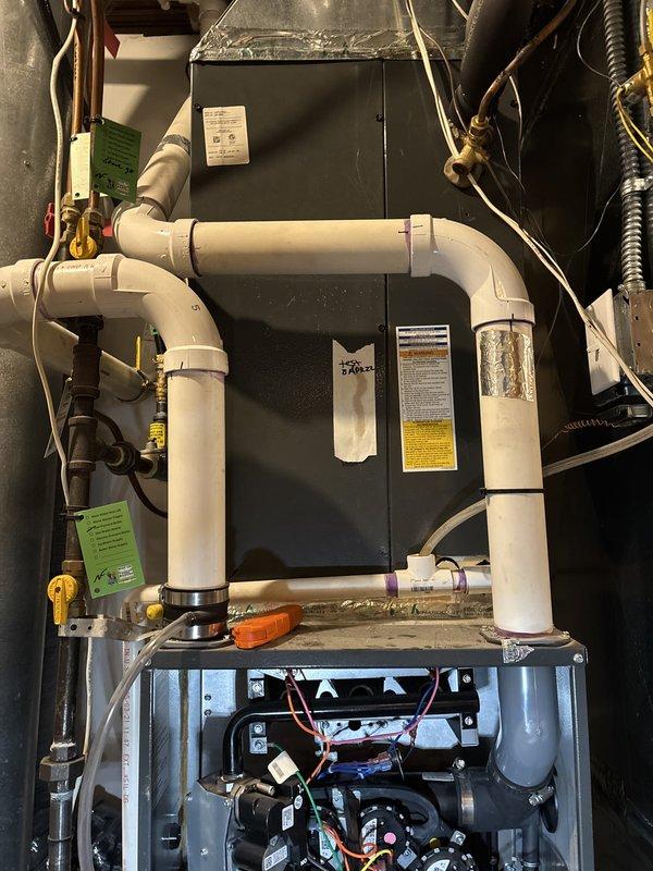 Performed annual furnace maintenance on a 4-year-old system as part of a recurring maintenance agreement. Conducted comprehensive inspection including thermostat operation, indoor air handler components, air filter, condensate drain, blower motor, inducer motor, and electrical wiring—all found to be operating within normal parameters. Verified temperature split across the system and inspected critical furnace components including igniter, flame sensor, and gas pressure readings.

During heat exchanger inspection, identified a compromised heat exchanger presenting a safety hazard. Immediately shut off gas ball valve to the furnace and red-tagged the system to prevent operation until repairs are completed. Documented findings with photographs of the installation and affected components. Completed parts order form and prepared estimate for heat exchanger replacement to restore safe system operation.