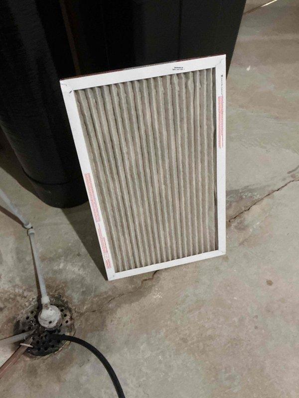 Performed scheduled furnace tune-up and inspection on 22-year-old unit. Upon thorough examination, discovered cracked heat exchanger, which poses a safety hazard and requires immediate attention. Documented findings with photographs and advised customer that heat exchanger replacement or complete furnace replacement is necessary. Inspected air filter, which showed moderate dust accumulation consistent with normal usage. Due to age of equipment and extent of heat exchanger damage, provided recommendation to obtain estimate for new furnace installation as most cost-effective long-term solution.
