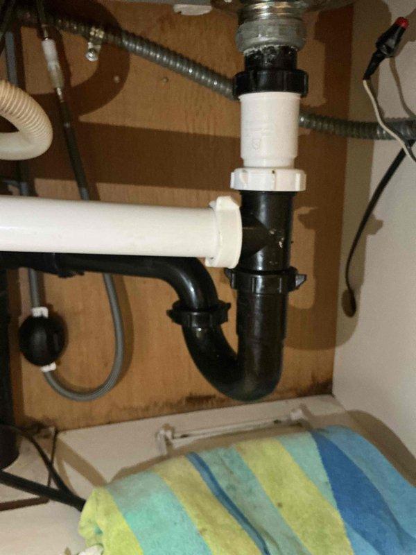 Responded to callback for recurring faucet leak. Performed adjustments to P-trap assembly and faucet head to resolve drainage and leak issues. All connections tightened and tested for proper operation.
