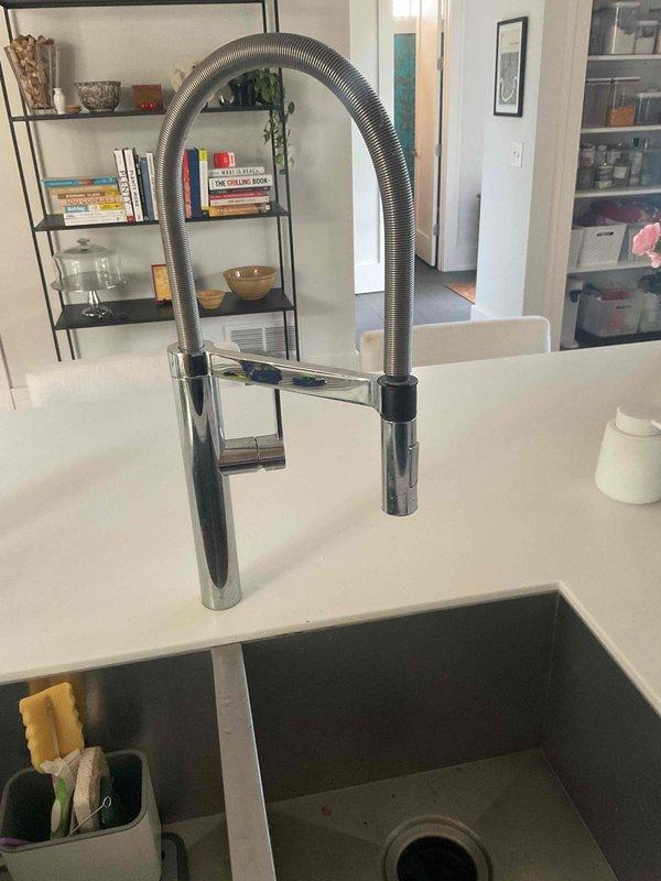 Responded to service call for malfunctioning Blanco kitchen faucet with commercial-style spring coil design and pull-down spray head. Supplied and installed manufacturer replacement parts to repair the faucet assembly. Upon installation, discovered the supplied faucet head was defective and non-operational. Performed system testing and inspection of the installation. Cleaned work area upon completion. One-year parts and labor warranty included with this repair.