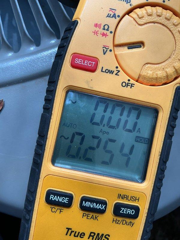 Responded to no cooling complaint on 10+ year old R410A system. Upon arrival, outdoor unit was humming but condenser fan blades were not rotating. Performed electrical diagnostics and discovered no power supply from main electrical panel to HVAC system. Traced power issue to Generac generator transfer switch control box, which was buzzing with no indicator light illuminated. Verified system ties into Generac automatic transfer system. Used digital multimeter to confirm zero voltage at unit disconnect and measured voltage readings at various test points to isolate power failure to generator control system. Customer has active warranty coverage with Generac for transfer switch equipment. Recommended contacting Generac service or licensed electrician to diagnose and repair generator control box malfunction before HVAC system can be restored to operation. Customer declined electrical service at this time and will coordinate Generac warranty service independently.