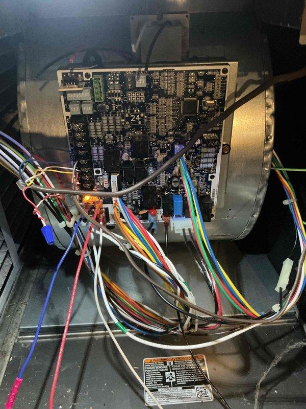 Responded to no cooling call at unoccupied duplex unit and diagnosed burned out transformer, fuse, and ECM blower motor. Replaced failed transformer and fuse to restore partial system functionality. ECM motor has been ordered and will require follow-up visit for installation to complete repair.