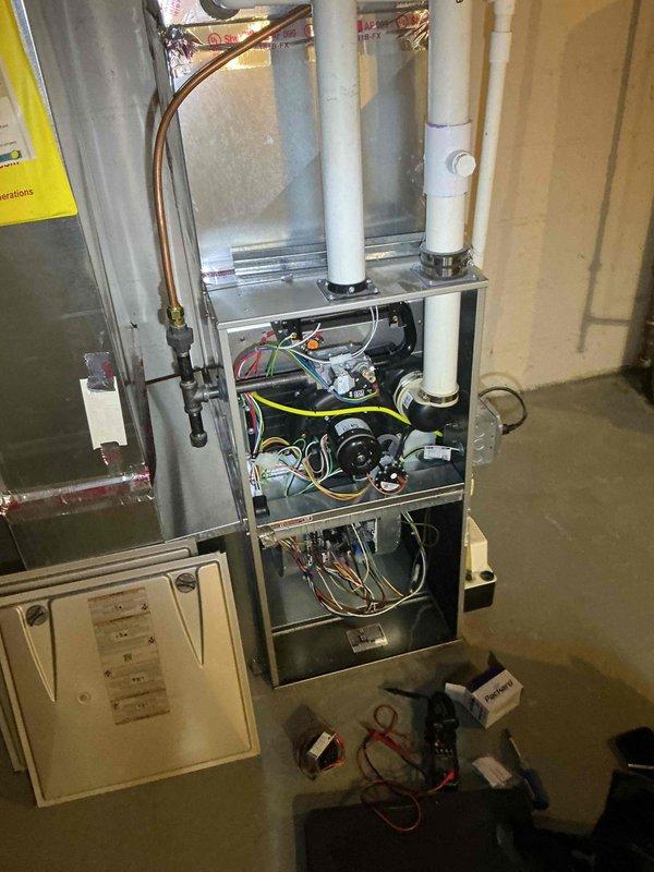 Responded to no cooling call at unoccupied duplex unit and diagnosed burned out transformer, fuse, and ECM blower motor. Replaced failed transformer and fuse to restore partial system functionality. ECM motor has been ordered and will require follow-up visit for installation to complete repair.