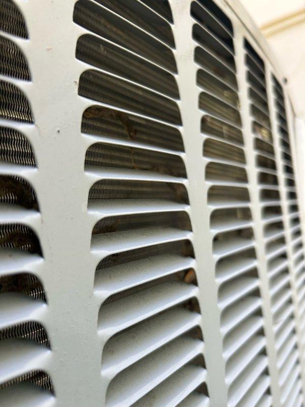 Responded to no cooling complaint on 7-year-old Daikin system. Upon arrival, discovered outdoor condenser coil heavily impacted with dirt and debris, and capacitor had failed. Verified indoor air filter was clean, blower motor operating correctly, and airflow adequate through supply registers. Replaced failed capacitor and performed thorough condenser coil cleaning to restore proper heat transfer capability. 

After completing repairs and restarting system, monitored operating pressures and temperatures. While system pressures showed improvement from initial readings, high-side pressure remained elevated and suction line temperature indicated insufficient cooling. Conducted comprehensive TXV bulb response testing using both warm and cold water applications while monitoring suction pressure, superheat, and subcooling values. Testing revealed no meaningful changes in system parameters, indicating TXV is not responding to temperature variations as designed.

System currently runs but fail