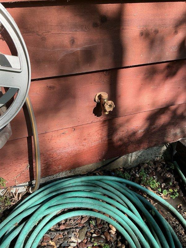Replaced two exterior frost-free hose bibbs and associated ball valves utilizing existing plumbing connections. Removed old outdoor faucets and installed new brass hose bibbs on the building's exterior siding. Accessed interior wall cavity to replace shut-off ball valves connected to the exterior spigots. All connections were secured and tested for proper operation and leak-free performance.