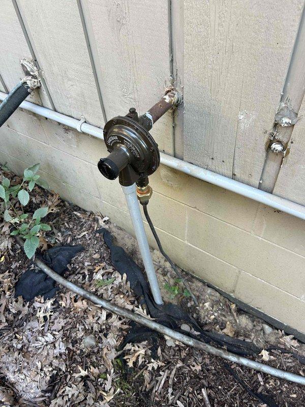 Responded to gas leak alarm concerns in basement following recent LP tank and regulator replacement by gas provider. Performed comprehensive leak detection using combustible gas detector at all accessible fittings, connections, and gas piping throughout the system with no detectable leaks found. No odor of gas present during inspection. Evaluated customer's gas detector and determined unit to be low-grade residential model that may be producing false readings. Recommended customer upgrade to higher-quality detection equipment or contact gas provider to perform formal pressure test on gas lines, as regulator adjustments fall under utility company jurisdiction and are outside scope of HVAC service work.
