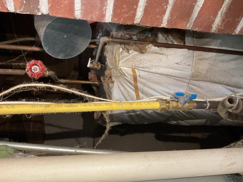 Responded to no cooling call on a 2002 Carrier air conditioning system at a rental property. Found outdoor unit humming but not starting, with condenser fan blades not operating. Diagnosed and replaced failed capacitor, restoring system operation. Performed basic repair as requested without full system evaluation.