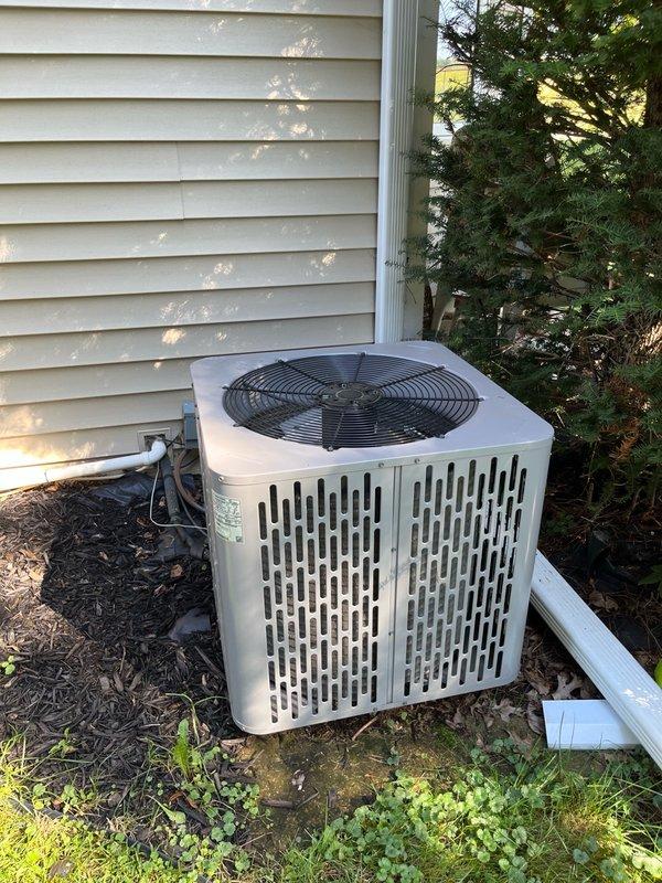 Responded to no cool call on 5-year-old central air conditioning system. Upon arrival, exterior breaker was in off position due to loud grinding noise reported by homeowner the previous evening. Homeowner also reported lights dimming during compressor startup throughout the summer season.

Restored power at exterior disconnect and observed normal operation with no abnormal noise present. Performed comprehensive electrical diagnostics including compressor winding resistance testing, contactor operation, capacitor values, and voltage measurements. All electrical components tested within manufacturer specifications. 

Cycled system power multiple times attempting to replicate reported grinding noise condition with negative results. Based on symptom description and dimming lights history, preliminary assessment indicates possible hard start condition or compressor start failure on single occurrence.

Interior inspection of condenser unit revealed significant accumulation of organic debris 