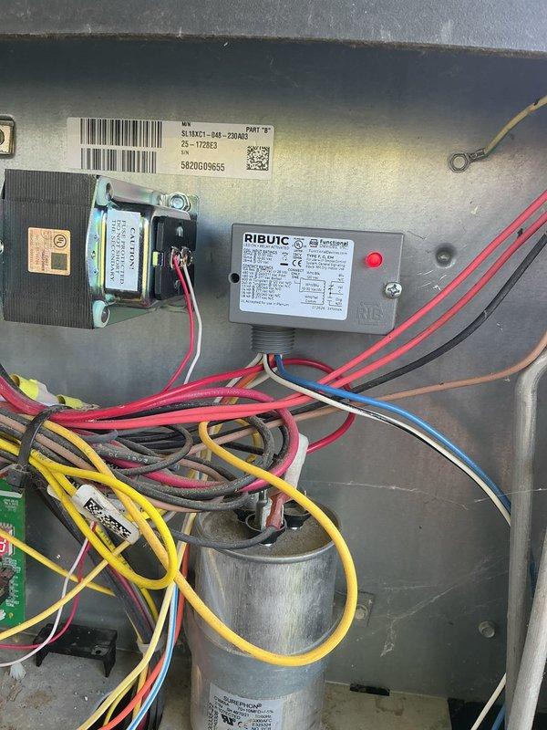 Responded to no cooling complaint on newer HVAC installation. Previous electrician had replaced transformer but unit remained non-operational. Retrieved RIB relay from shop and returned to site to complete repair. Installed RIB relay on condenser unit, restoring proper control circuit operation. Tested system operation and confirmed air conditioning unit returned to full functionality. Unit now cooling properly with all electrical components operating as designed.