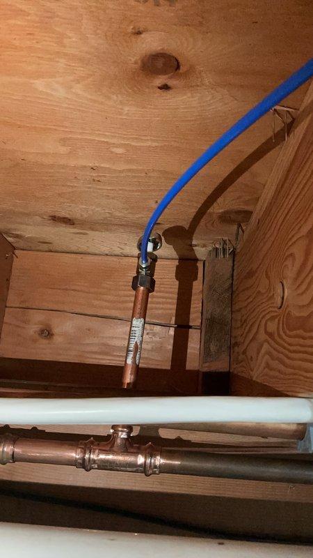 Responded to callback for leak at newly installed connection point in basement. Upon inspection, discovered refrigerator water supply line connection to shutoff valve was leaking at the connection point installed during previous visit. Removed and replaced the defective section of refrigerator line with new tubing, ensuring proper connection to the existing shutoff valve. Tested system under pressure to verify leak was eliminated and all connections were secure.