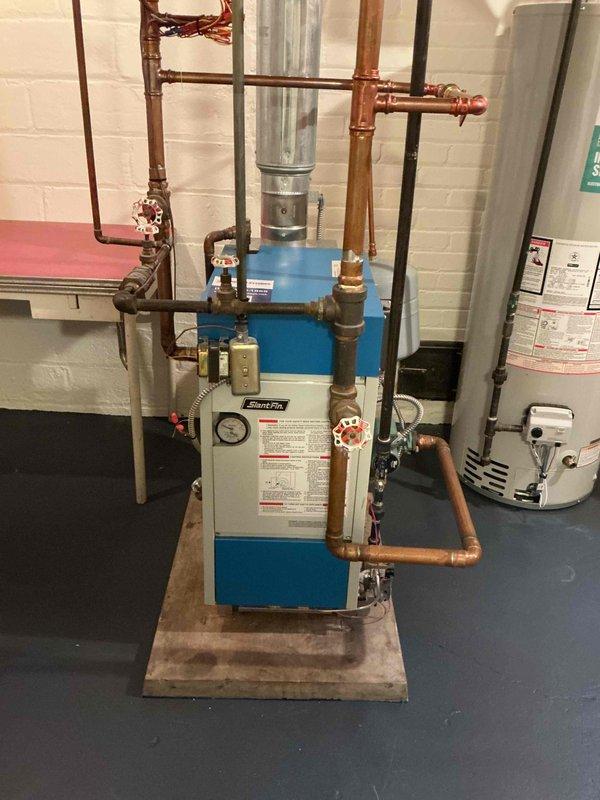 Completed annual fall heating maintenance visit on residential Slant Fin boiler system, air exchanger, and dryer vent cleaning. Performed comprehensive inspection of boiler including all piping, two-zone operation, circulator pump, backflow preventer, pressure relief valve, heat exchanger, burners, system pressure, and combustion analysis—all components found to be functioning within acceptable parameters with no leaks detected. Combustion testing revealed 1 PPM carbon monoxide emission from lower heat exchanger seals beginning to deteriorate, which does not require immediate shutdown but warrants continued monitoring. Reviewed repair and replacement options with customer and scheduled follow-up service advisor consultation to address heat exchanger seal condition.