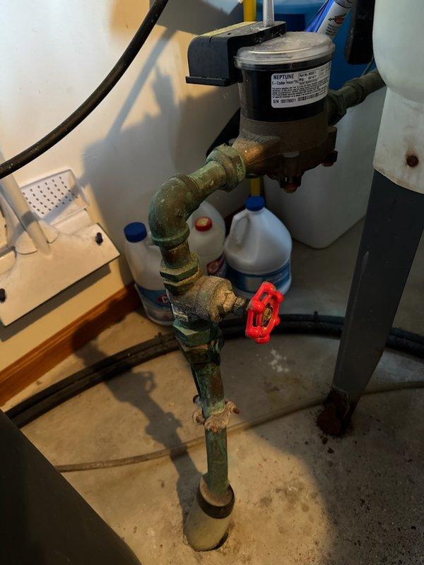 Responded to no water condition at residence caused by city shut-off due to accidental pipe penetration. Customer had pierced copper water line with screw while working on wall, creating active leak. Main shut-off valve was non-functional with spinning handle, preventing water isolation at the property. Replaced failed main water shut-off valve to restore proper water control capability. Repaired damaged copper pipe section by cutting out compromised area and splicing in new piping with appropriate fittings and solder joints. Restored full water service to home and verified system integrity with no additional leaks detected.