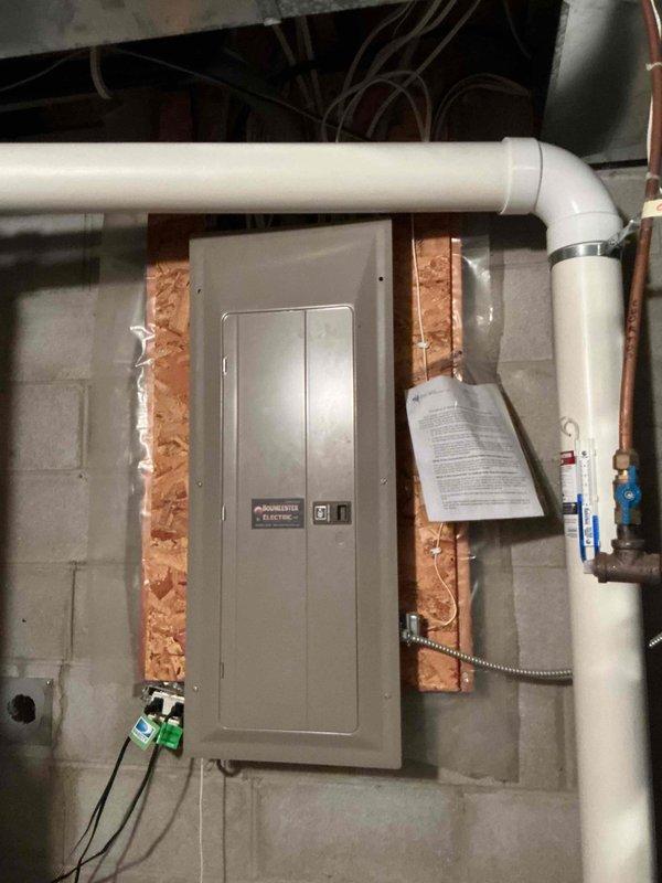 Responded to no cooling complaint on 1-year-old system. Found indoor unit operating but outdoor condenser not receiving power. Traced electrical circuit and discovered contactor not energizing due to loose thermostat wire connections. Located improperly secured wire nuts with masking tape at wall penetration point before furnace connection, likely disturbed during recent painting work. Removed inadequate connections, stripped and re-terminated thermostat wiring with proper wire nuts, and secured connections with electrical tape to prevent future loosening. Verified contactor engagement and confirmed outdoor unit operation. System restored to normal cooling function.