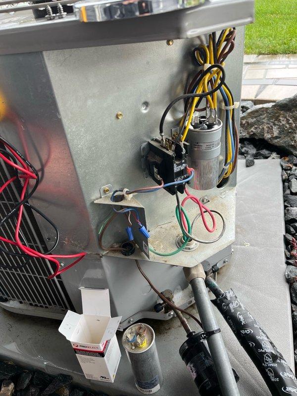 Responded to service call for outdoor air conditioning condenser unit experiencing operational issues. Diagnosed failed dual-value capacitor as the cause of system malfunction. Removed defective capacitor and installed new dual-value secondary start device from stock inventory. Completed full system operational testing following capacitor replacement, verifying proper compressor and fan motor startup, correct amperage draws, and normal cooling cycle operation. Unit restored to proper working condition with all components functioning within manufacturer specifications.