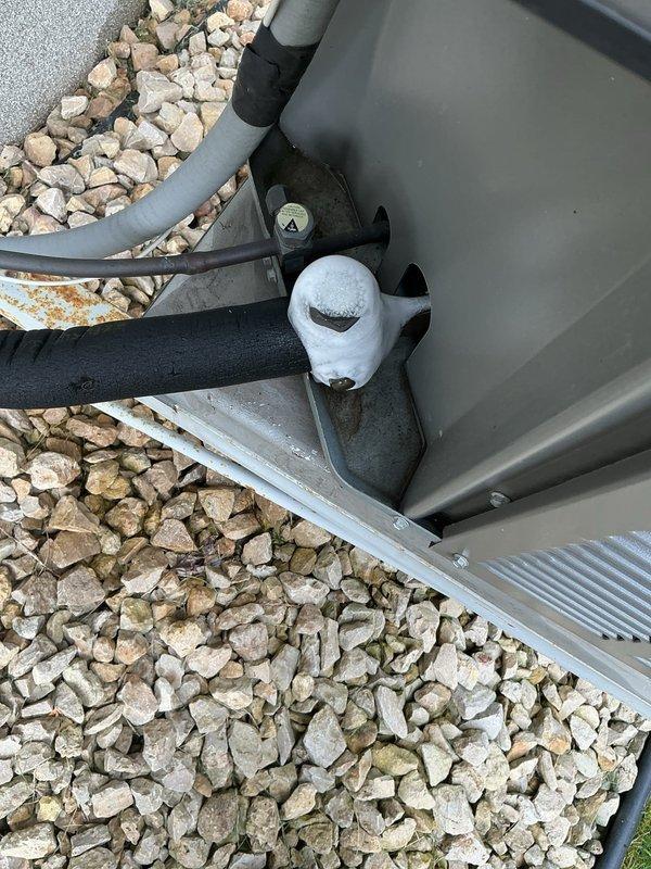 Responded to no cooling complaint on 12-year-old residential HVAC system. Upon arrival, found extensive ice formation from evaporator coil through to compressor motor, indicating restricted airflow or refrigerant issue. System was shut down to allow complete thawing of frozen components. Scheduled return visit for next day to perform diagnostic evaluation once system has fully thawed and can be properly tested to determine root cause of freezing condition.