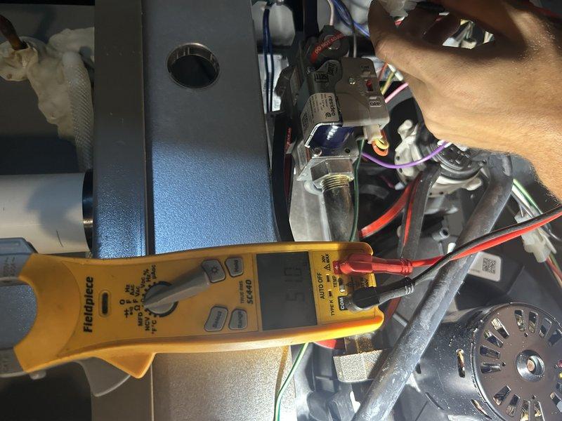 Performed comprehensive tune-up on furnace and air conditioning system with three-zone configuration. Verified operation across all zones, confirmed air filter condition, and cleared condensate trap and pressure switch ports. Cleaned flame sensor, inspected igniter, and verified blower compartment was clear of debris.

Proceeded to outdoor unit where critical issues were identified and resolved. Discovered defrost board incorrectly set to 50° instead of proper 90-100° range and corrected setting. Found incoming line voltage connections to contactor were extremely loose, causing overheating and melting of the contactor. Replaced failed contactor and secured all electrical connections. Performed thorough coil cleaning on condenser unit and tested all components. System now operating within manufacturer specifications across all zones.