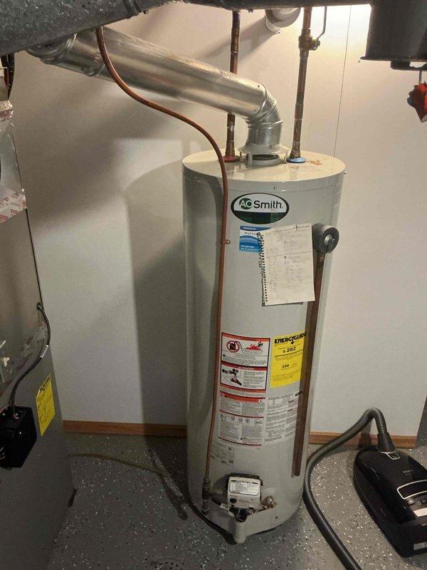 Performed complete replacement of 10+ year old natural gas 50-gallon A.O. Smith water heater. Initial testing confirmed unit had exceeded its serviceable lifespan and required replacement. Removed existing water heater, installed new A.O. Smith 50-gallon natural gas unit with proper venting through existing ductwork, connected copper supply lines, and verified all safety controls and temperature settings. Unit tested and operational upon completion.