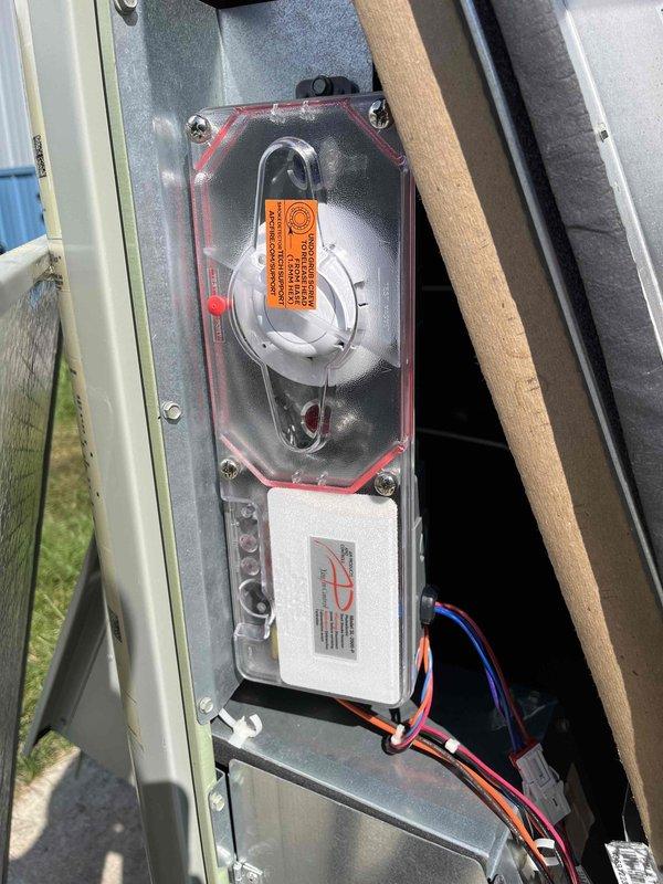 Replaced defective return air smoke detector under warranty. Reconfigured exhaust and intake pipe orientation on new detector to improve airflow and ensure proper air sampling capability. Verified system operation for 30 minutes post-installation to confirm detector functionality and proper performance.