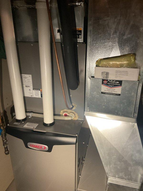 Performed comprehensive furnace tune-up on Lennox unit, including cleaning flame sensor, verifying condensate drainage, and measuring gas pressure at 4.5" low fire and 9.58" high fire with all systems operating within specifications. Inspected black flexible ductwork in attic space where customer reported bee infiltration and nest buildup; assessed damage and submitted parts request for approximately one-hour flex duct replacement. Coordinated with homeowner via phone to complete service and provided information regarding available membership programs.