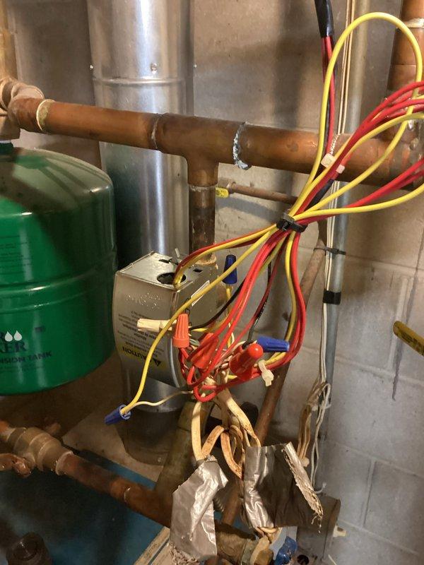 Completed preventative maintenance on residential boiler system. Corrected low water pressure by adding water to the system, cleaned igniter assembly by brushing off accumulated debris, and performed comprehensive safety inspection including carbon monoxide leak testing. All operational parameters verified within normal range, unit heating properly with no issues identified.