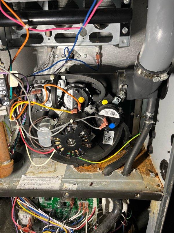 Responded to service call for furnace with leaking inducer motor covered under parts and labor warranty. Removed and replaced the defective original inducer motor assembly with new warranty replacement unit. Upon completion of installation, performed comprehensive system testing including furnace operation verification and complete venting system inspection. All components functioned properly with no issues detected. Unit restored to full operational status.