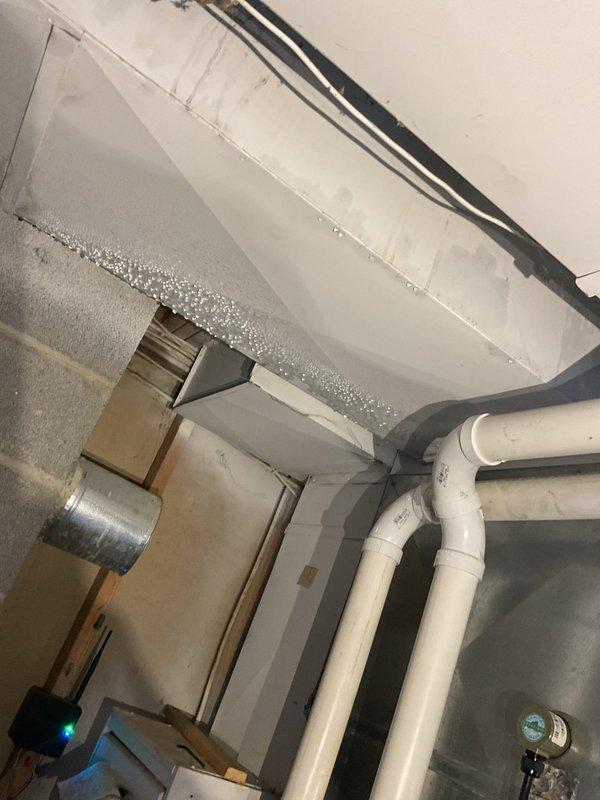 Completed comprehensive furnace tune-up and maintenance per membership agreement protocol. Identified significant condensation issue on basement ductwork caused by excessive cooling setpoint creating sweating conditions on supply ducts. Adjusted low-stage cooling airflow by increasing CFM by 100 to improve system performance and efficiency. Recommended installation of basement dehumidifier to address moisture concerns and prevent future condensation damage to ductwork and surrounding areas.