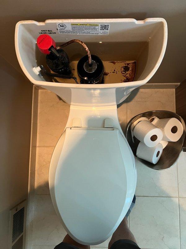 Responded to service call for continuously running toilet in master bathroom on top floor. Upon inspection, identified failed flush seal causing constant water flow and inefficient flushing mechanism. Removed tank lid and assessed internal components, noting deteriorated flush seal and aging fill valve assembly. Replaced both the flush valve seal and complete fill valve assembly with new components to restore proper operation. Tested flush cycle and verified proper water shutoff, fill level, and refill tube connection. Toilet now functioning correctly with no running water between flush cycles.