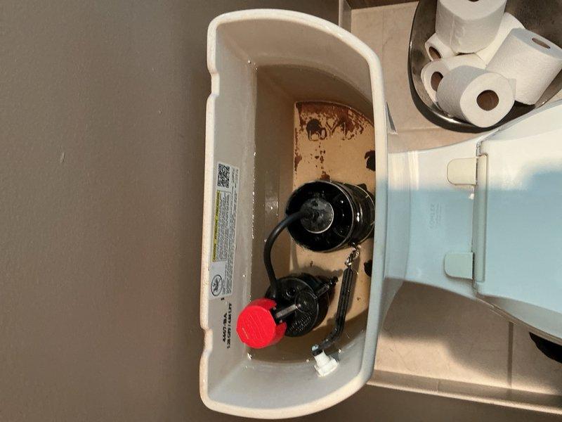 Responded to service call for continuously running toilet in master bathroom on top floor. Upon inspection, identified failed flush seal causing constant water flow and inefficient flushing mechanism. Removed tank lid and assessed internal components, noting deteriorated flush seal and aging fill valve assembly. Replaced both the flush valve seal and complete fill valve assembly with new components to restore proper operation. Tested flush cycle and verified proper water shutoff, fill level, and refill tube connection. Toilet now functioning correctly with no running water between flush cycles.