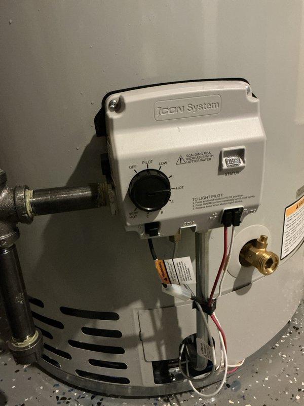 Completed full replacement of 50-gallon natural gas standard vent water heater in attic crawl space, removing existing unit and installing new like-for-like equipment. Connected copper supply lines to tank with proper pressure relief valve assembly and installed gas control valve with pilot safety system. Established all water connections, verified proper venting through existing PVC flue system, and tested gas line connections for leaks. Performed system startup, ignited pilot light, adjusted temperature controls, and confirmed proper operation of all safety mechanisms. Identified main water valve requiring replacement and provided proposal for future service. All work completed per specifications with system fully operational and tested.